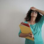 person overwhelmed by screens