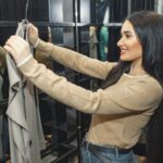 woman trying on e cup bra